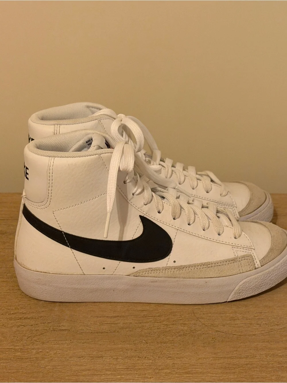 Nike White High-Top Sneakers with Black Swoosh Accent